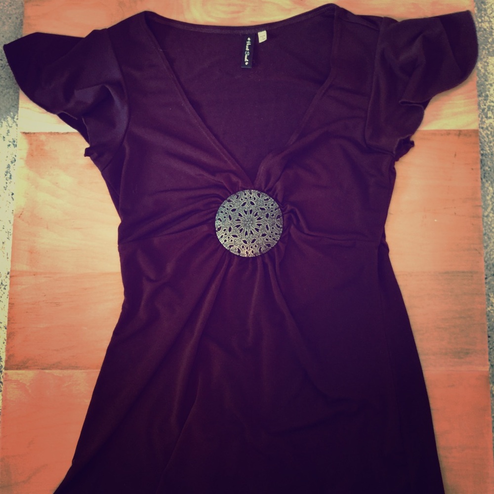 Deep brown blouse with decorative detail design.